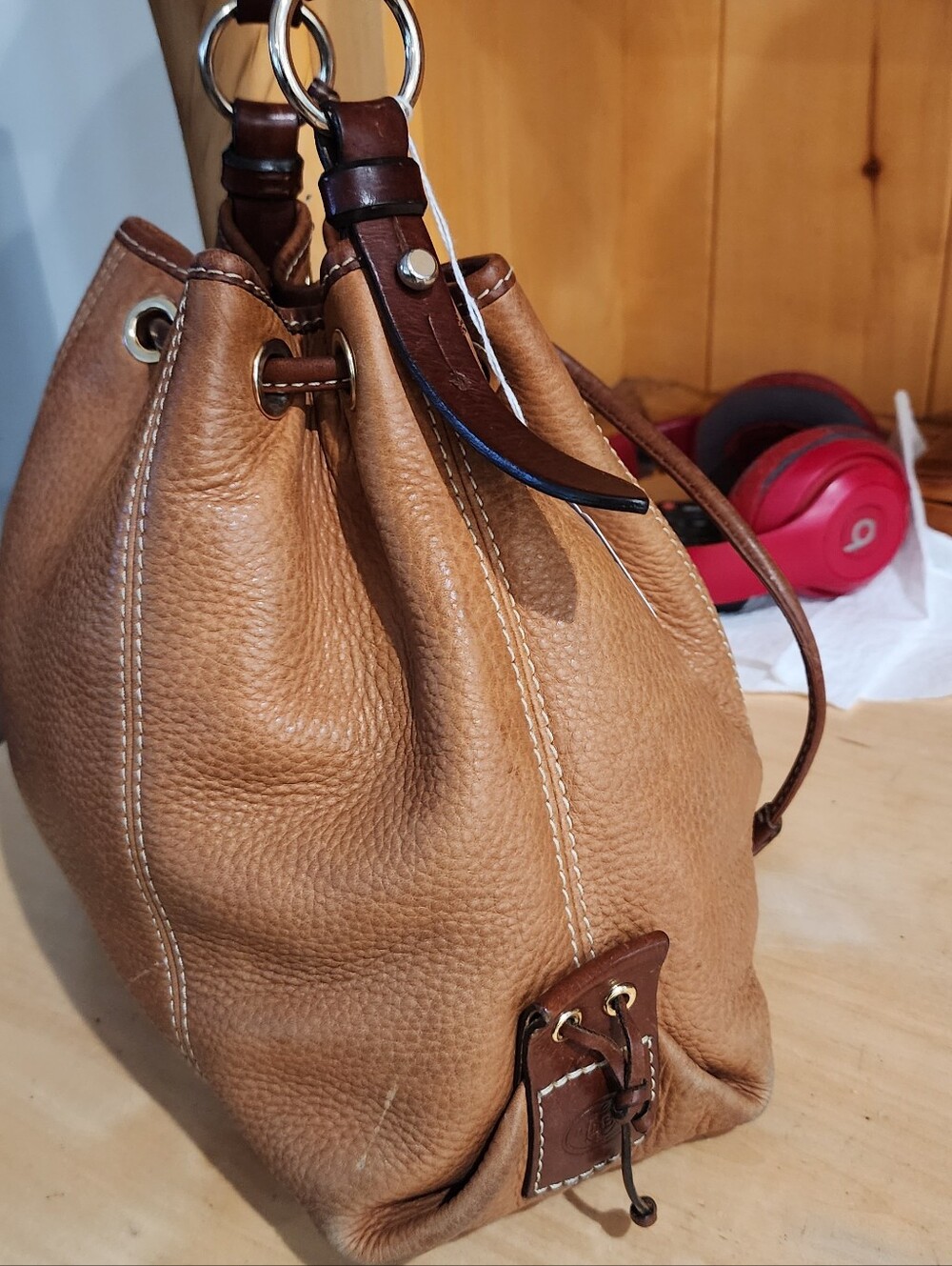 Dooney & Bourke Pebble Leather Drawstring Bucket Bag in Cognac - Picture 2 of 7